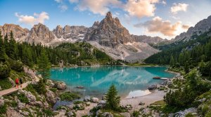 Turquoise alpine lake below jagged Dolomite peaks